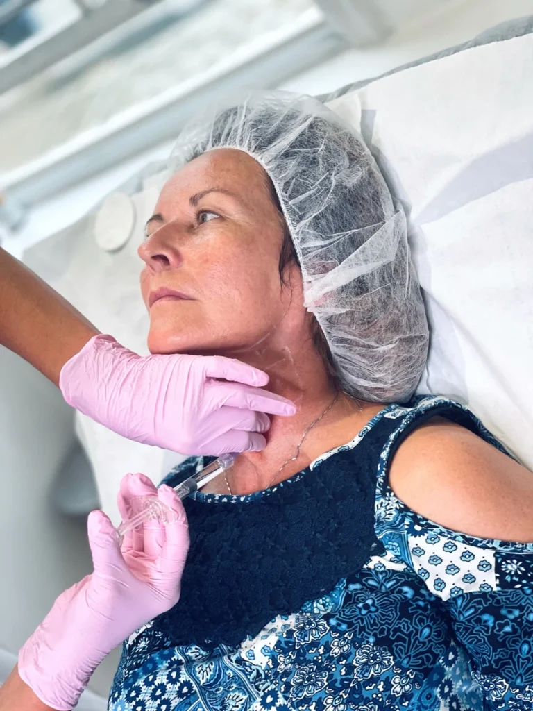adult woman gets profhilo for neck treatment at skinoza clinic